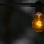 Low wattage bulb against a dark background